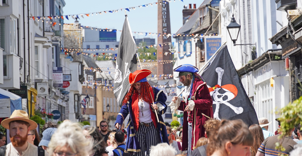 Stilt walkers at Plymouth Pirates